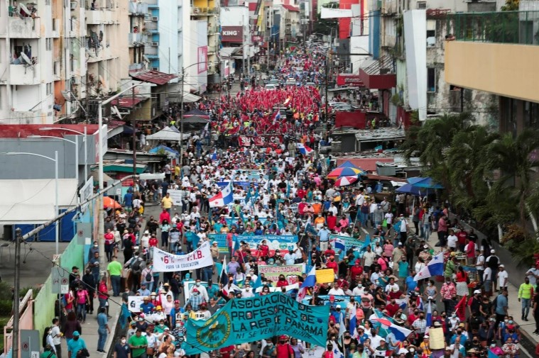 Demonstrators take part in a protest to demand the government steps in to curb inflation, lower fuel and food prices, in Panama City. [File: Erick Marciscano/Reuters]